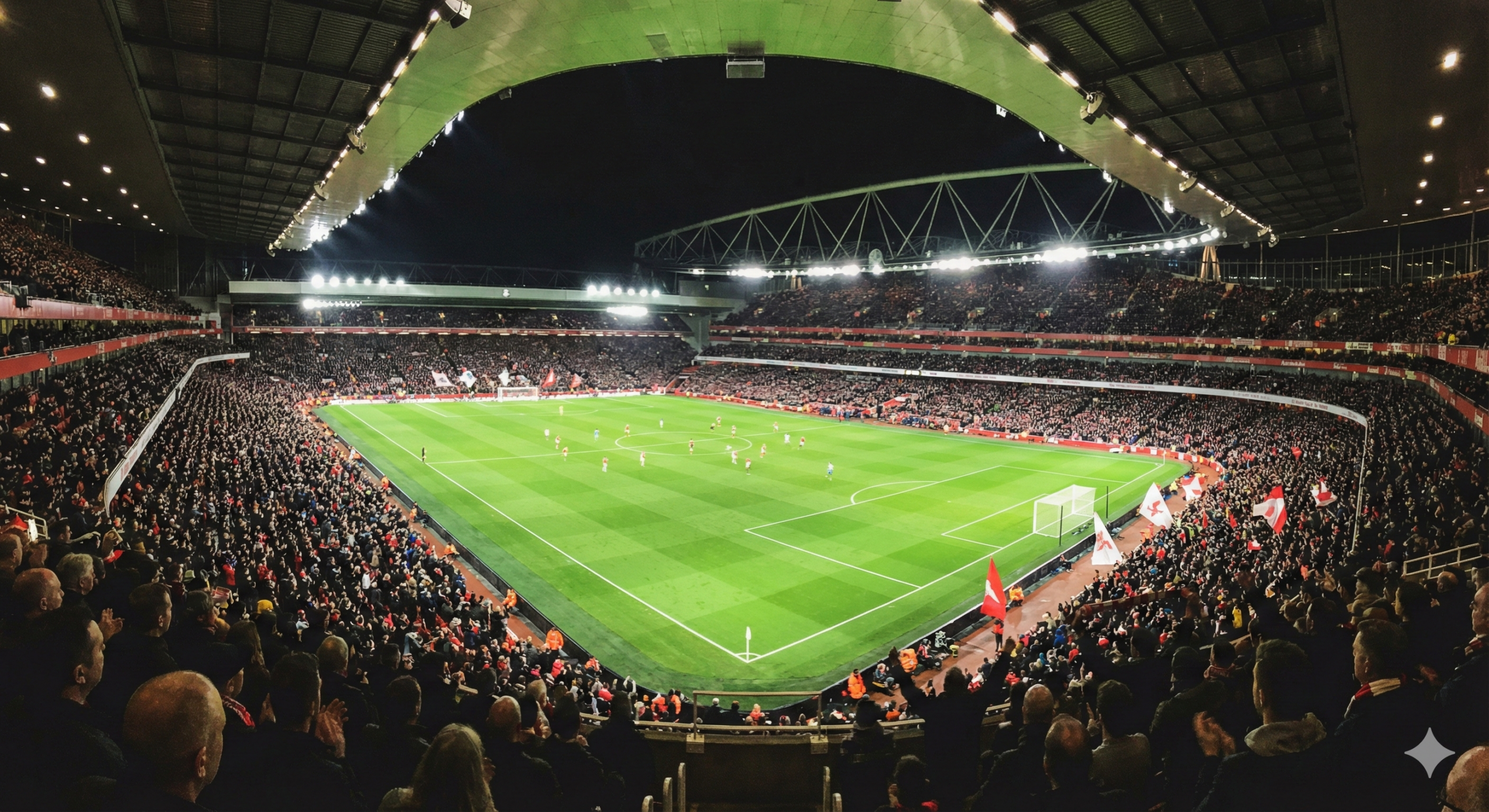 一张展现英超比赛现场宏大氛围的内容配图。视角设在球场看台上方,俯瞰灯火通明的绿茵场。画面捕捉了周中夜赛的精彩瞬间,草坪在泛光灯照射下翠绿耀眼,球员在场上激烈拼抢留下的动态模糊身影。看台四周挤满了热情的球迷,模糊的旗帜和闪光灯点缀其中,传达出比赛日的狂热气氛。这张图片用于在文章中间分隔不同的比赛预测段落,增强读者的沉浸感,风格写实且色彩饱满。